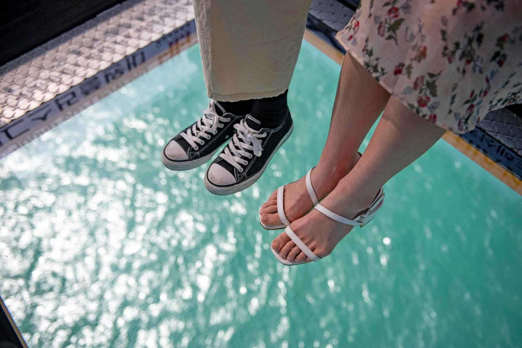 Visitors walking along the Songdo Skywalk with ocean views