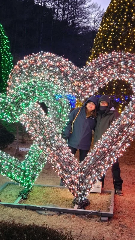 Filipino tourists enjoying Garden of Morning Calm night landscape
