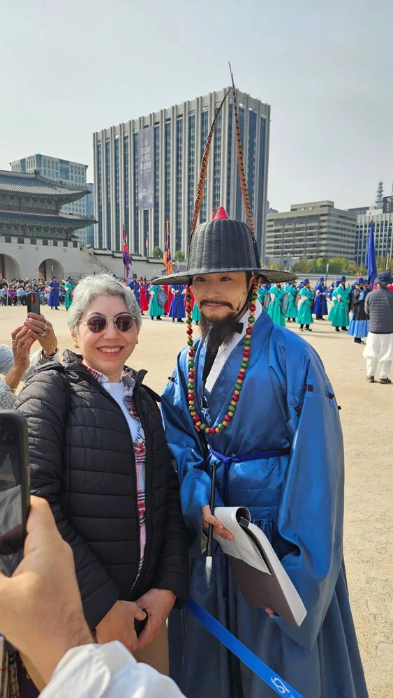 Turkish guests in hanbok during a private Seoul palace tour, capturing traditional Korean culture at Gyeongbokgung.