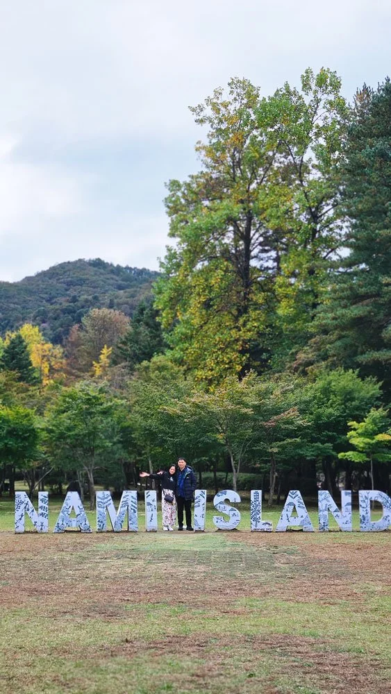 Private tour guests from the Philippines taking photos under the famous metasequoia trees on Nami Island.
