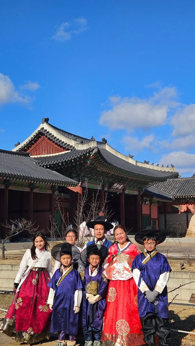Family exploring Gyeongbokgung Palace on a private tour in Seoul
