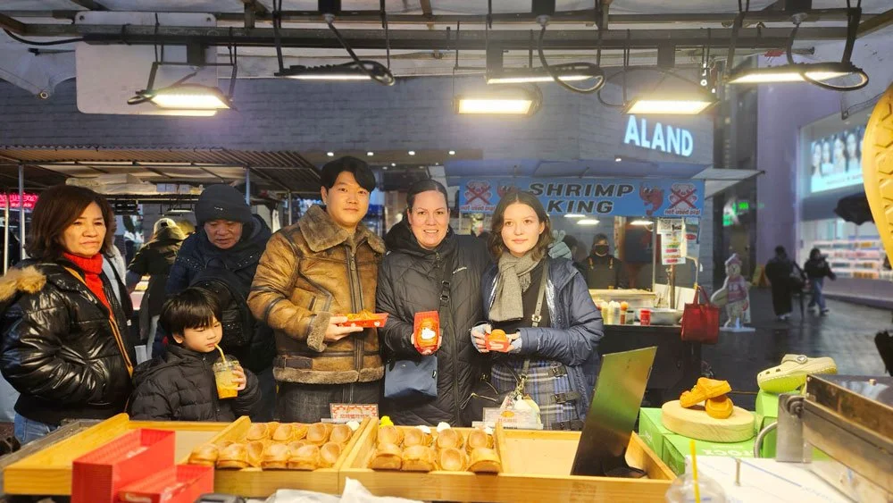 Mexico family shopping in the bustling district of Myeongdong.