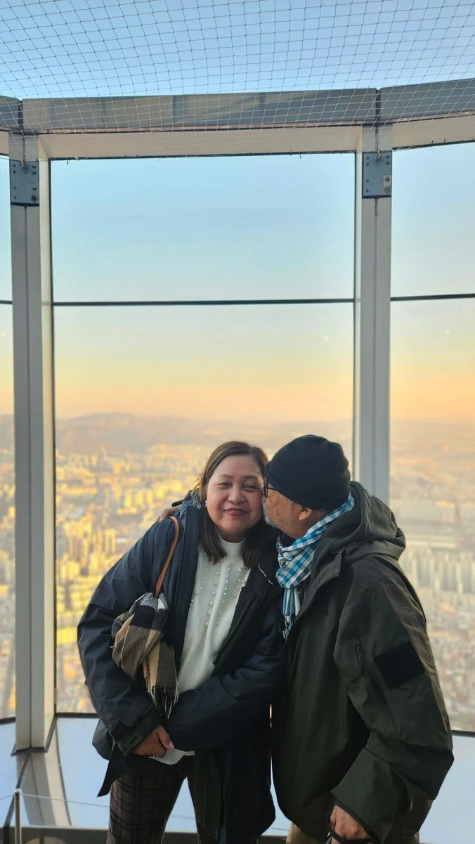 Filipino visitors taking photos at Lotte World Tower Seoul landmark
