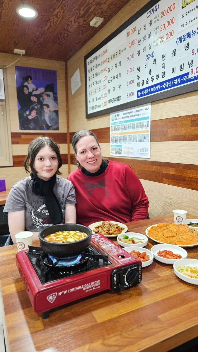 Mexico family experiencing delicious Korean food during their trip to Seoul.