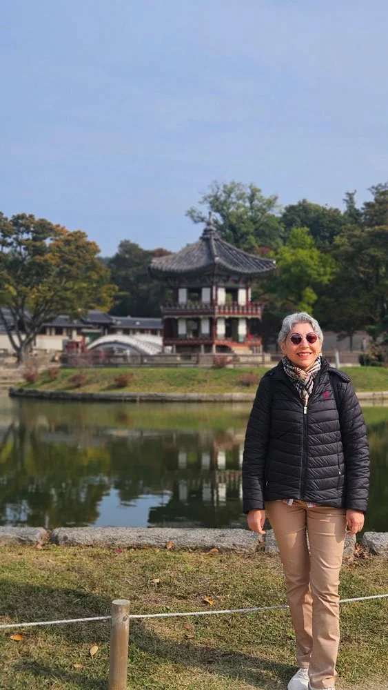 Custom-made Korea tour for Turkish tourists exploring the traditional rooftops and palace walls of Gyeongbokgung.