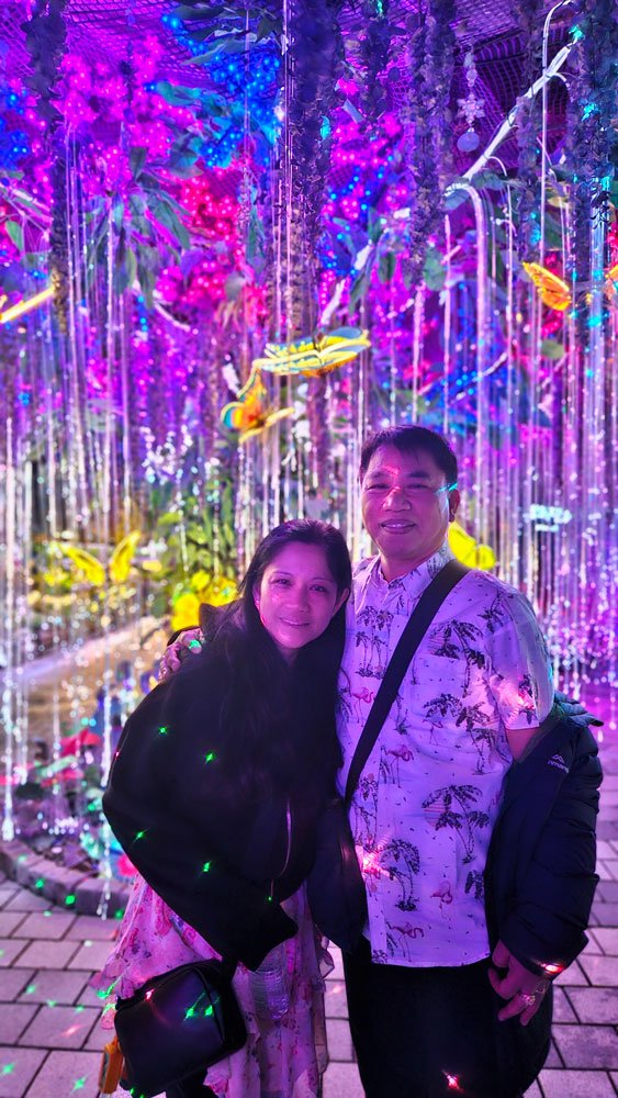 Filipino visitors enjoying the underground lake and lighting attractions during a private Gwangmyeong Cave tour.