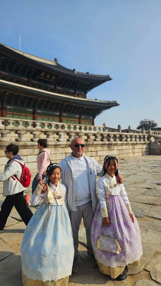 Private Korea tour for Turkish guests walking through the main gate of Gyeongbokgung Palace during a personalized Seoul itinerary.