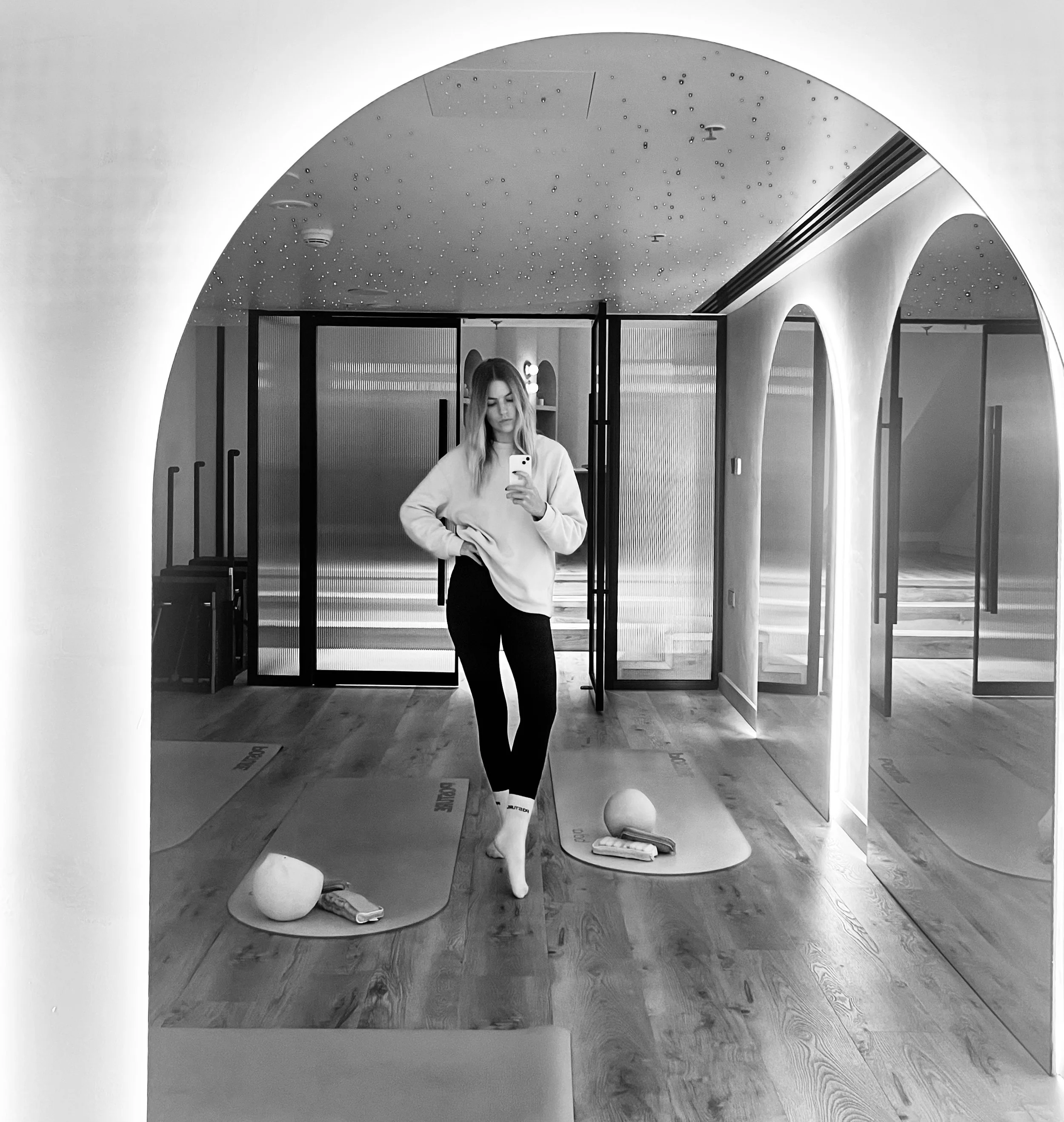 Experienced pilates instructor, Addie Browne picture in the pilate studio mat room of Posture Downtown, Dubai.