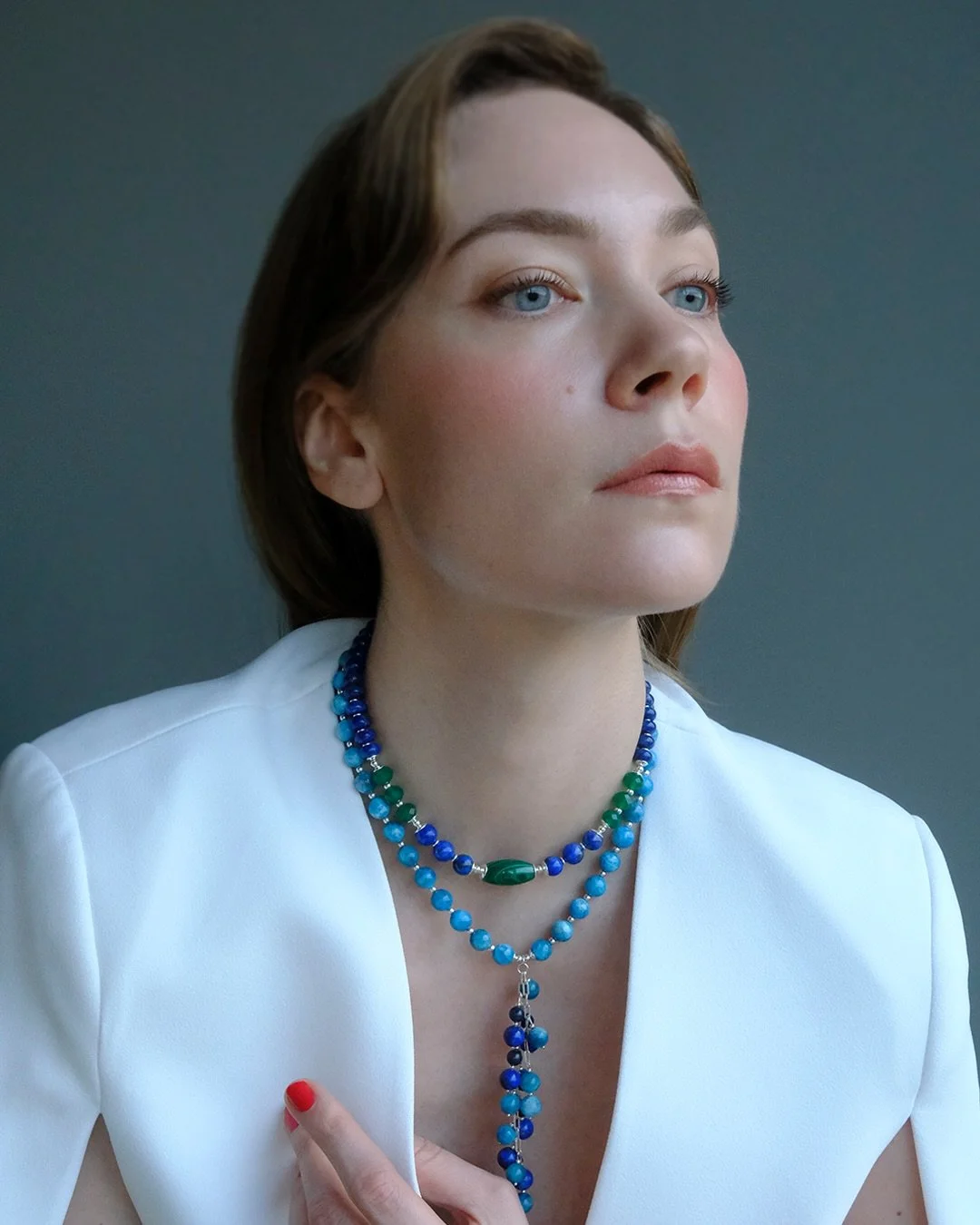 The not very obvious piece &mdash; the Azure Flow necklace &mdash; blooms when worn. It may be not easy to understand when on display, but perception changes once you put it on. 

Bright azure aparite beads pair perfectly with deep blue lapis lazuli.