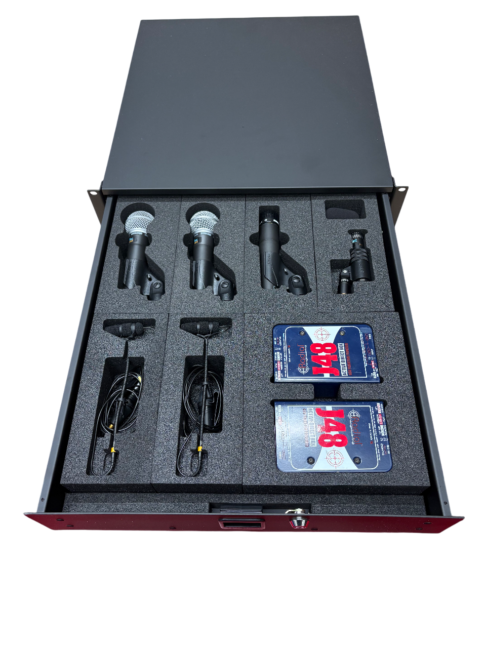 Set of four microphones, two wired body microphones, two wireless microphone receivers, and two wireless receiver batteries organized in foam compartments inside a metal case.