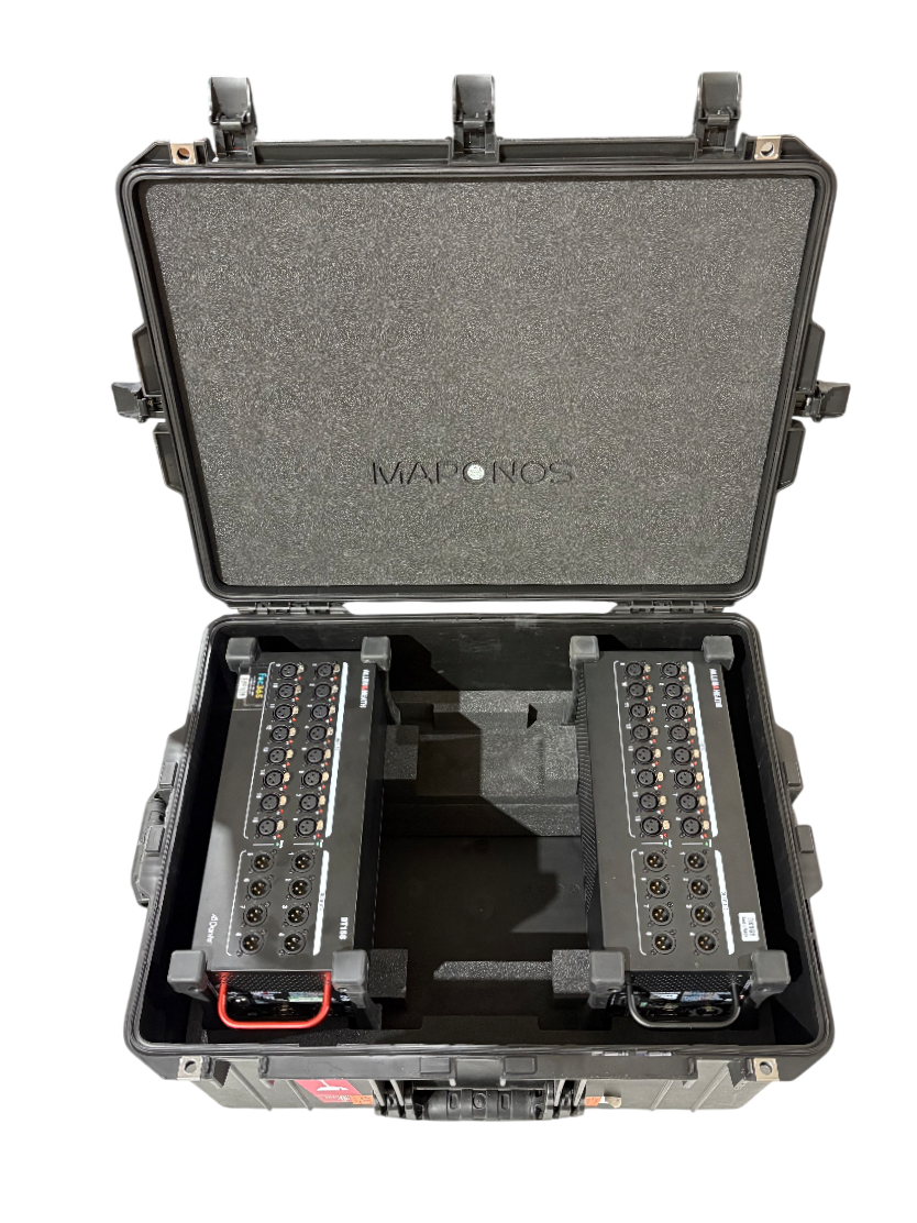 A black protective case containing two audio amplifiers with various input and output connections.