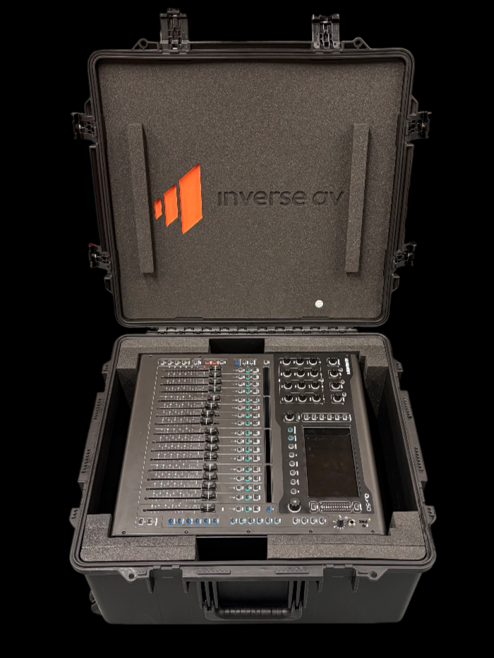 Open black hard case with foam-lined interior containing a digital audio mixer and control panel for music and sound management.