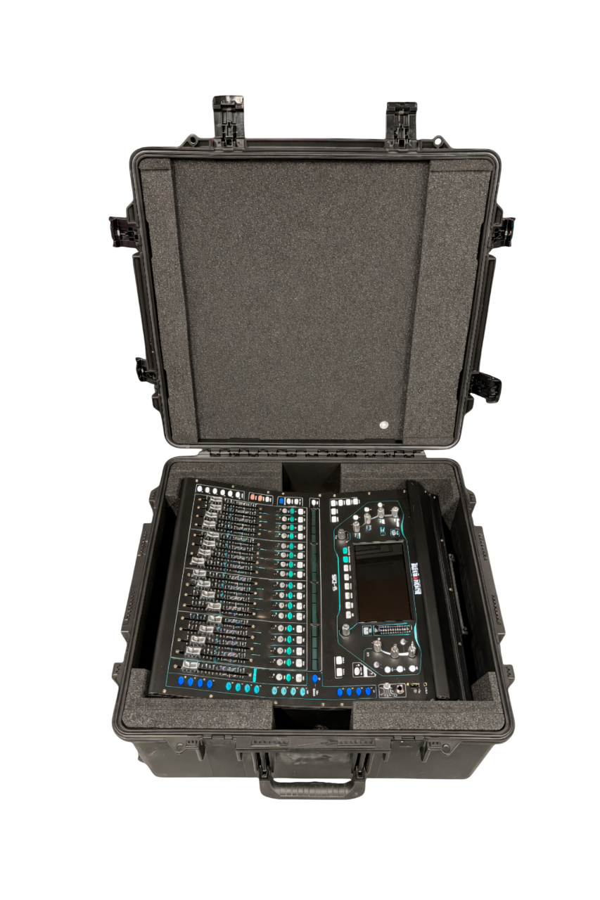 An open black protective case with foam padding, containing a digital audio mixing console with various controls and a screen.