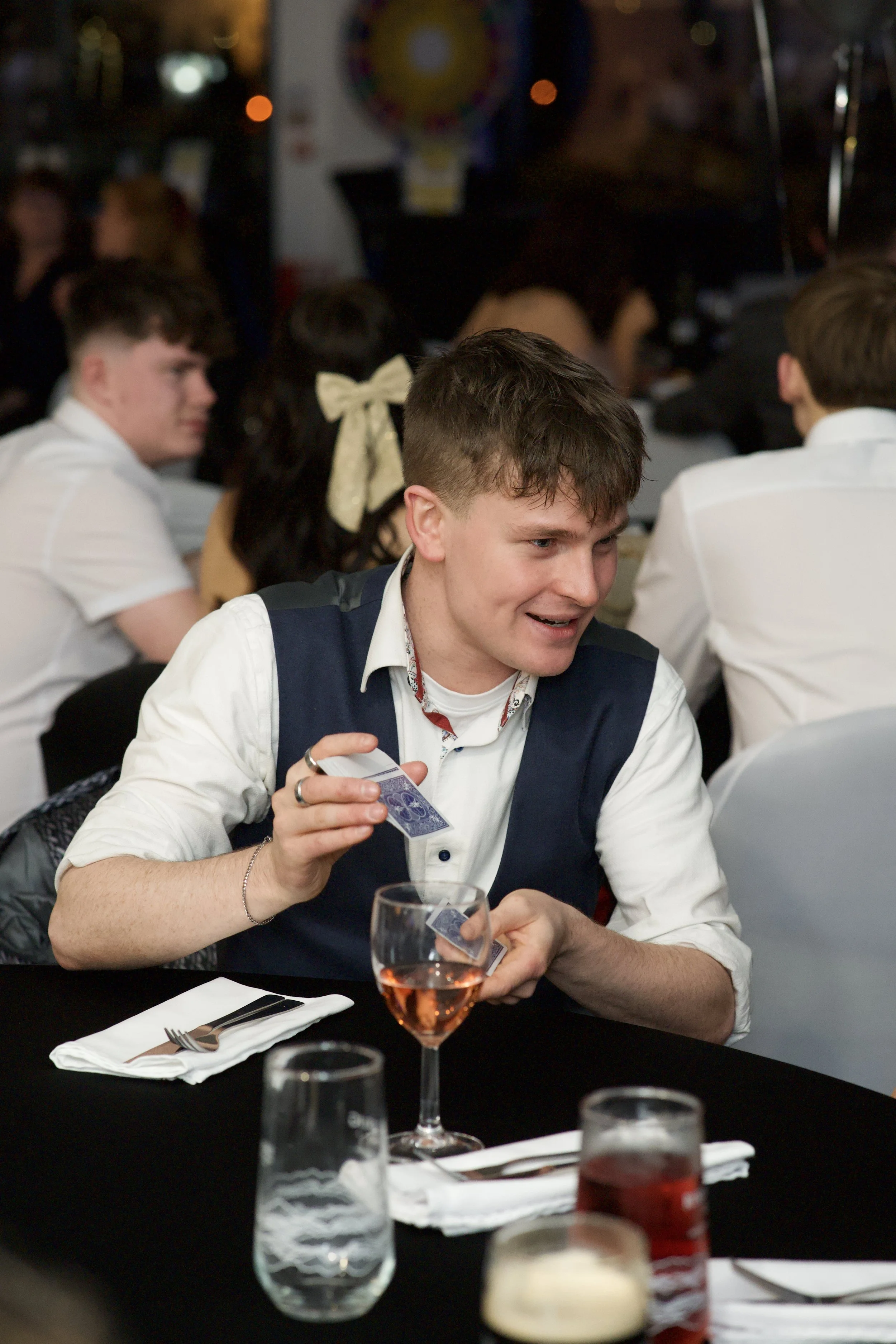 Local Manchester magician Daniel Maze wows guests at a wedding with unforgettable illusions and sleight of hand.