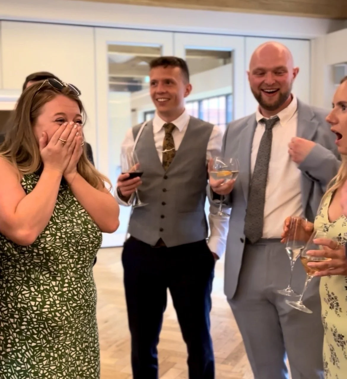Amazing reaction at Colshaw Hall in Manchester, Cheshire, with Wedding guests smiling and laughing to magic trick. 