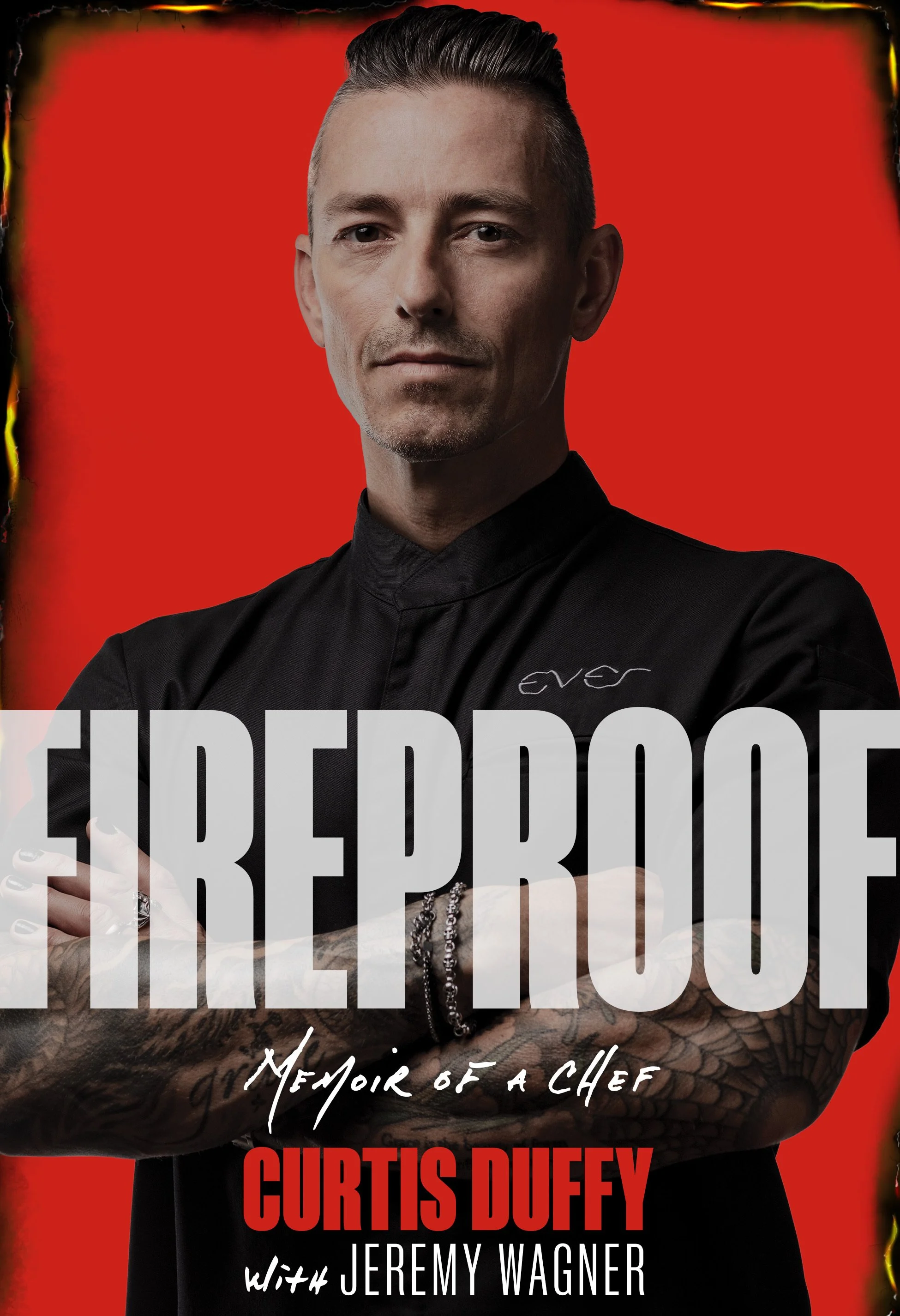 Cover of Fireproof: Memoir of a Chef by Curtis Duffy. Cover includes a red background with an image of Chef Duffy in his black chef's jacket.  The cover looks slightly burnt around the edges.