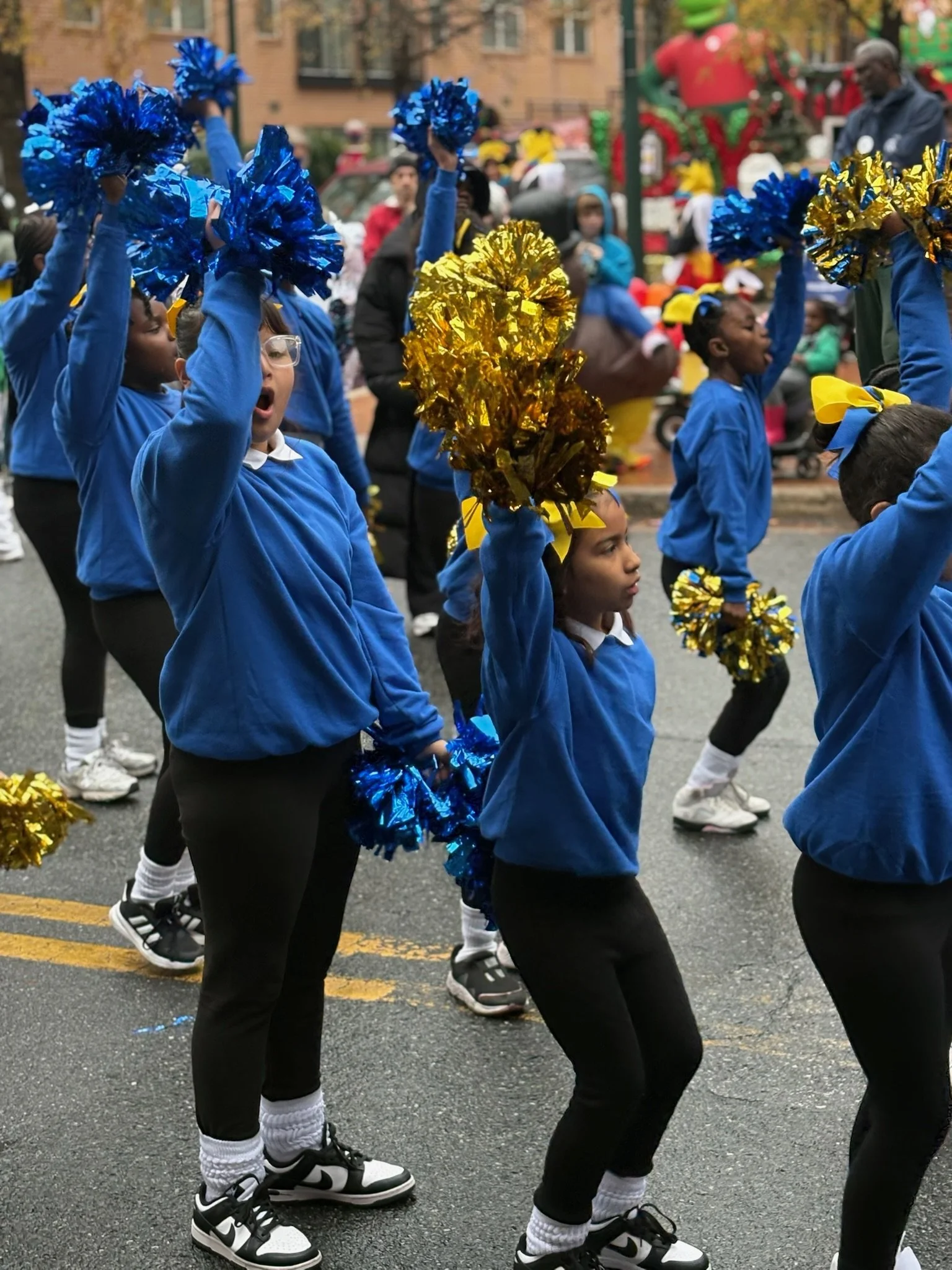 Cheerleaders with pom poms.