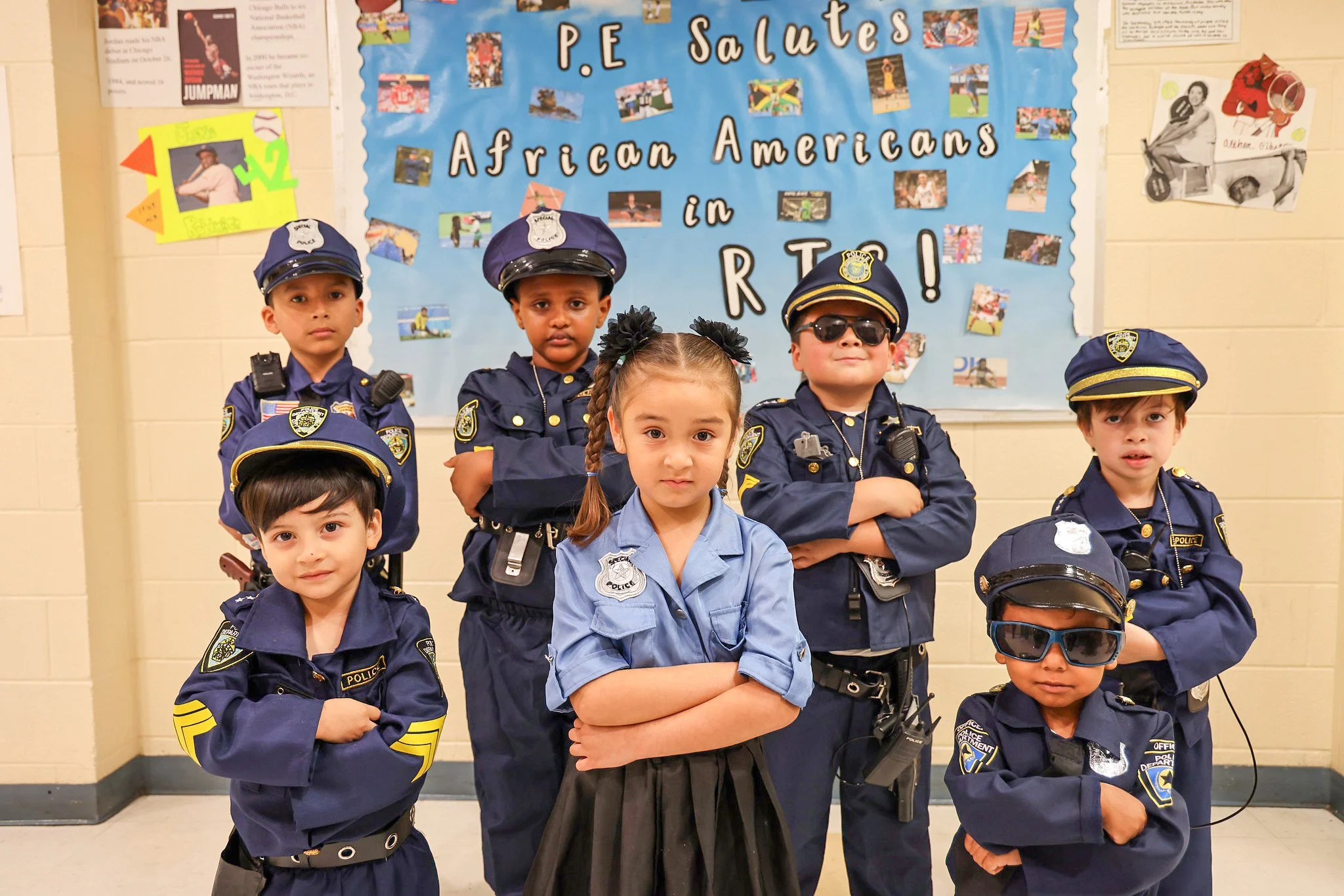 Kids dressed up in halloween police officer costumes.