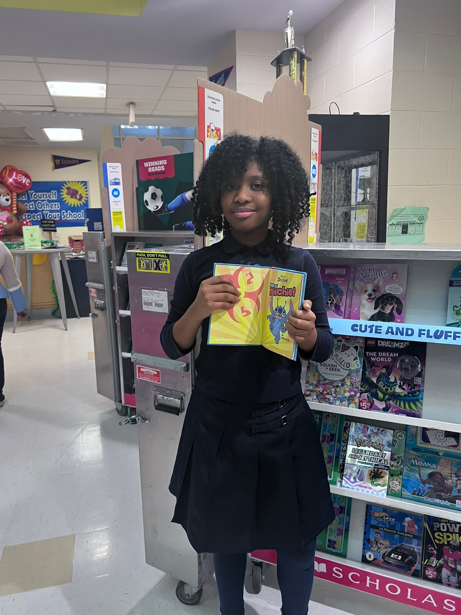 Student holding a book.