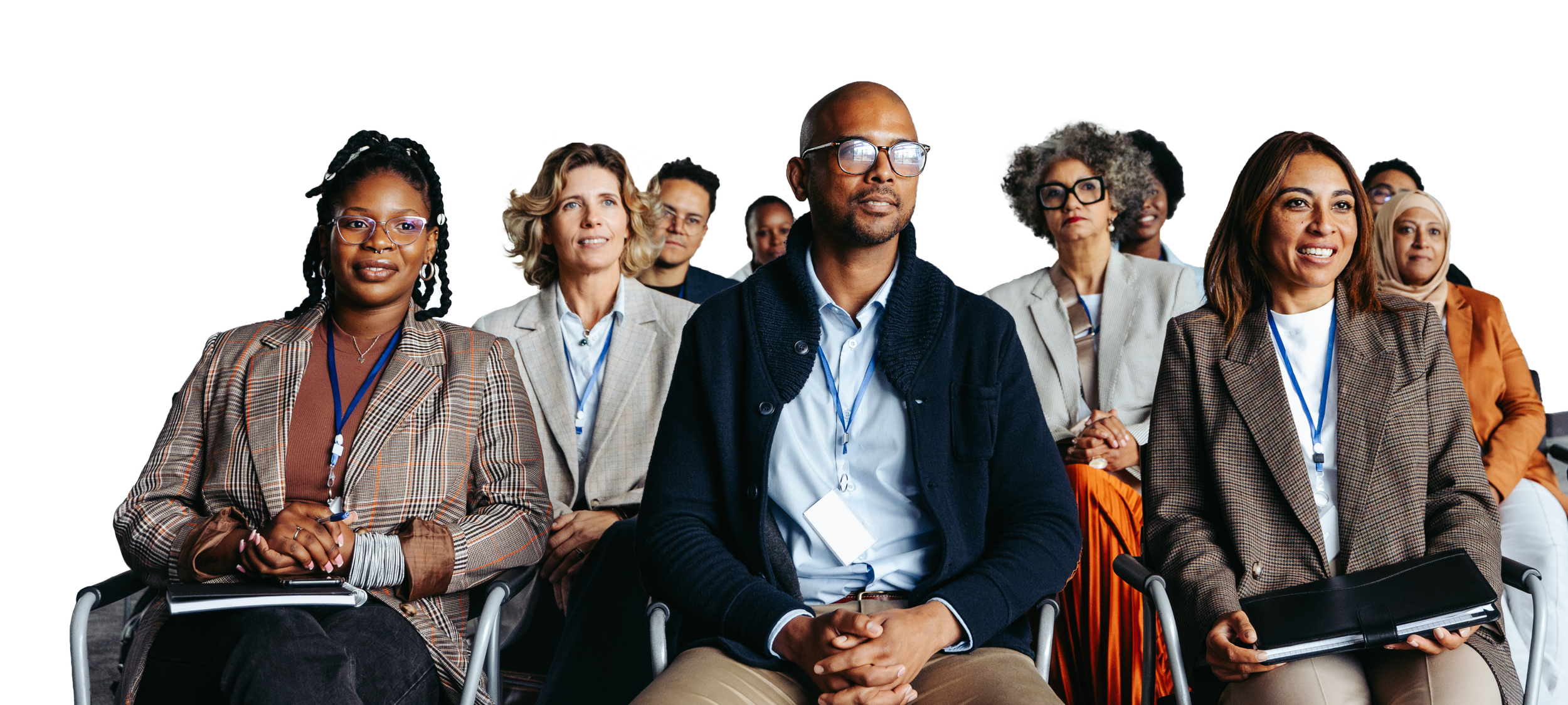 Real estate professionals in business attire seated together at a continuing education class