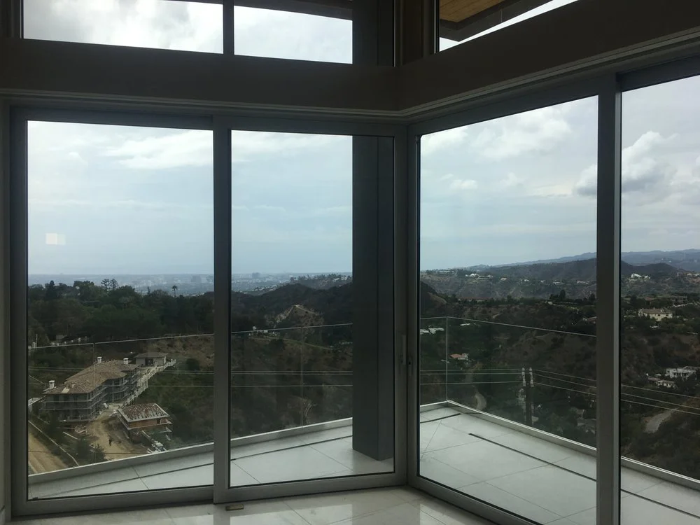 A view out of sliding glass doors in a home located in the hills of Los Angeles.