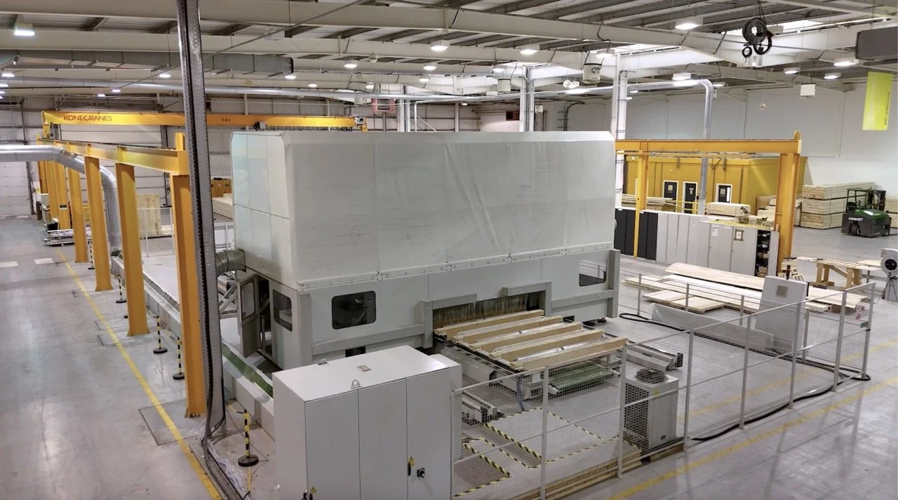 Large CNC machine for timber in factory environment.