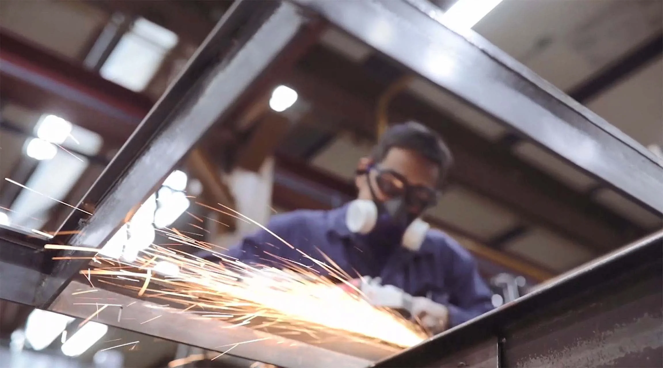 MHB craftsman welding an SL30-ISO profile system.jpg