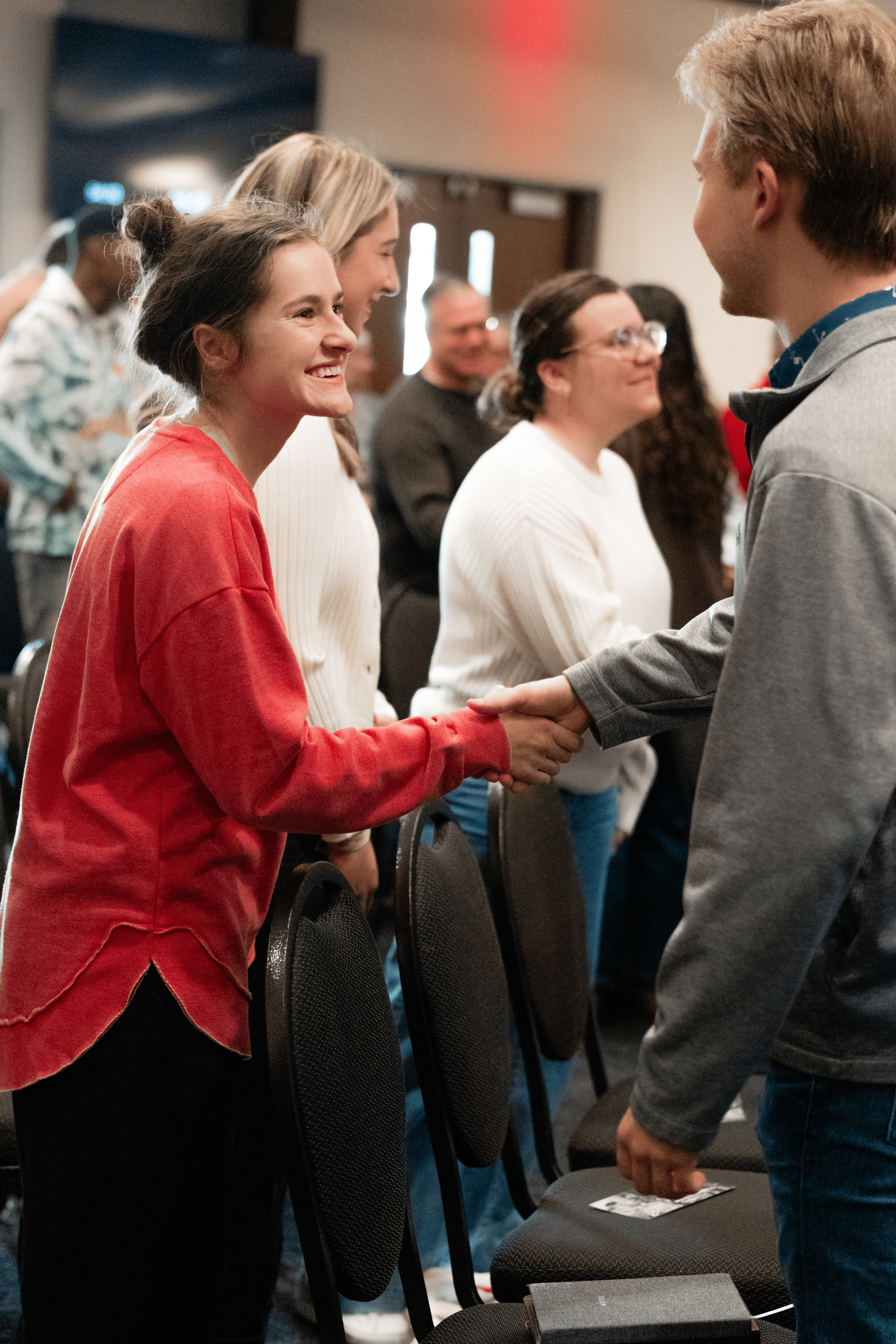 family greeting during service two friends handshake