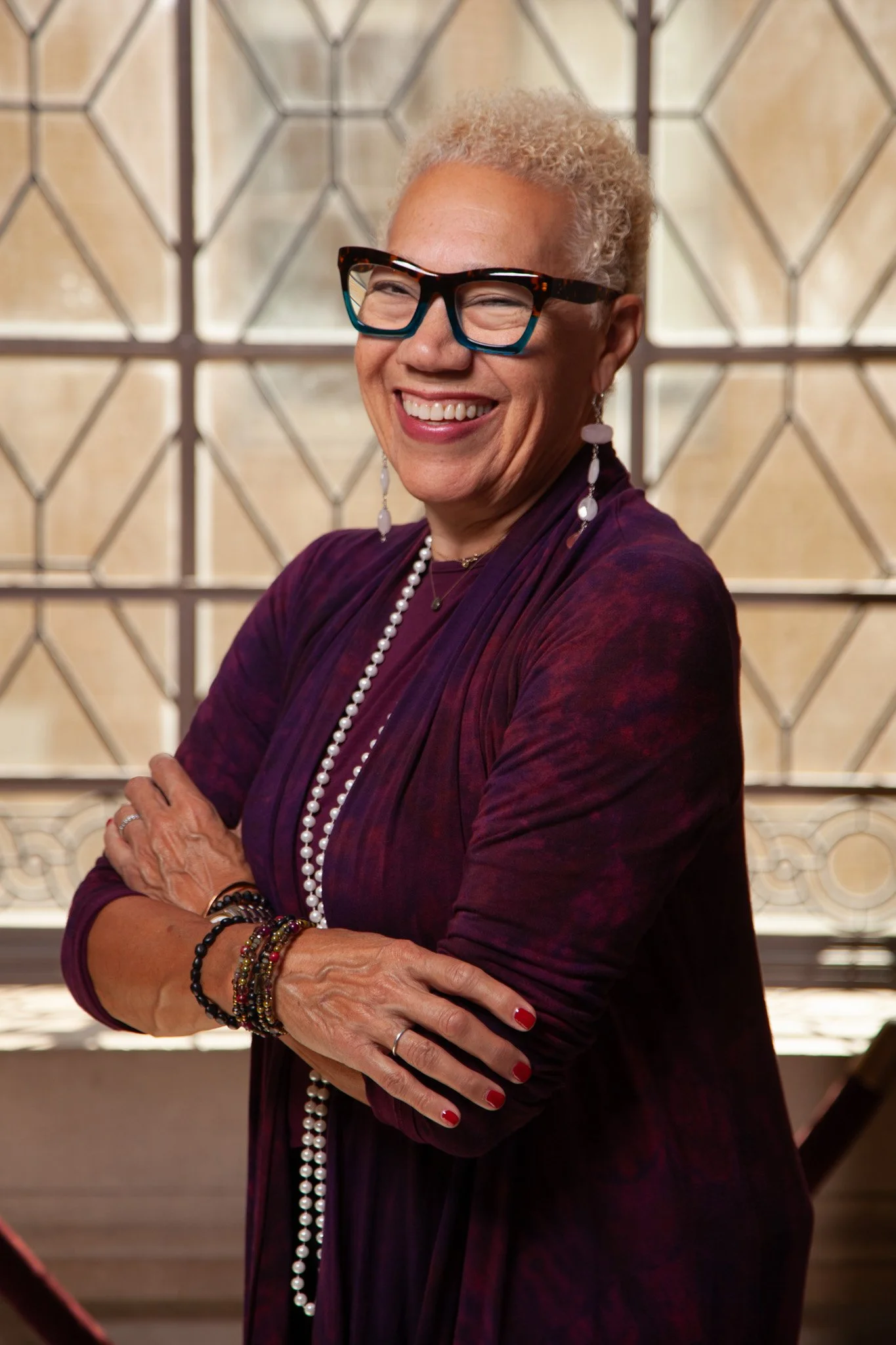 Warm-and-inclusive-non-denominational-wedding-officiant-Dr-Gaye-Walton-smiling-during-a-personalized-outdoor-wedding-ceremony-for-a-couple