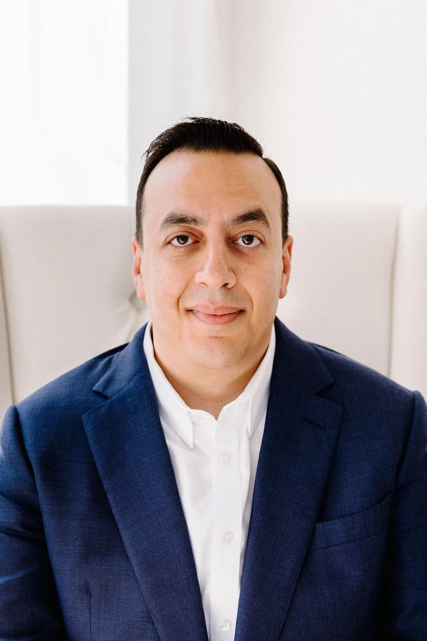 image of Andrew sitting in a chair