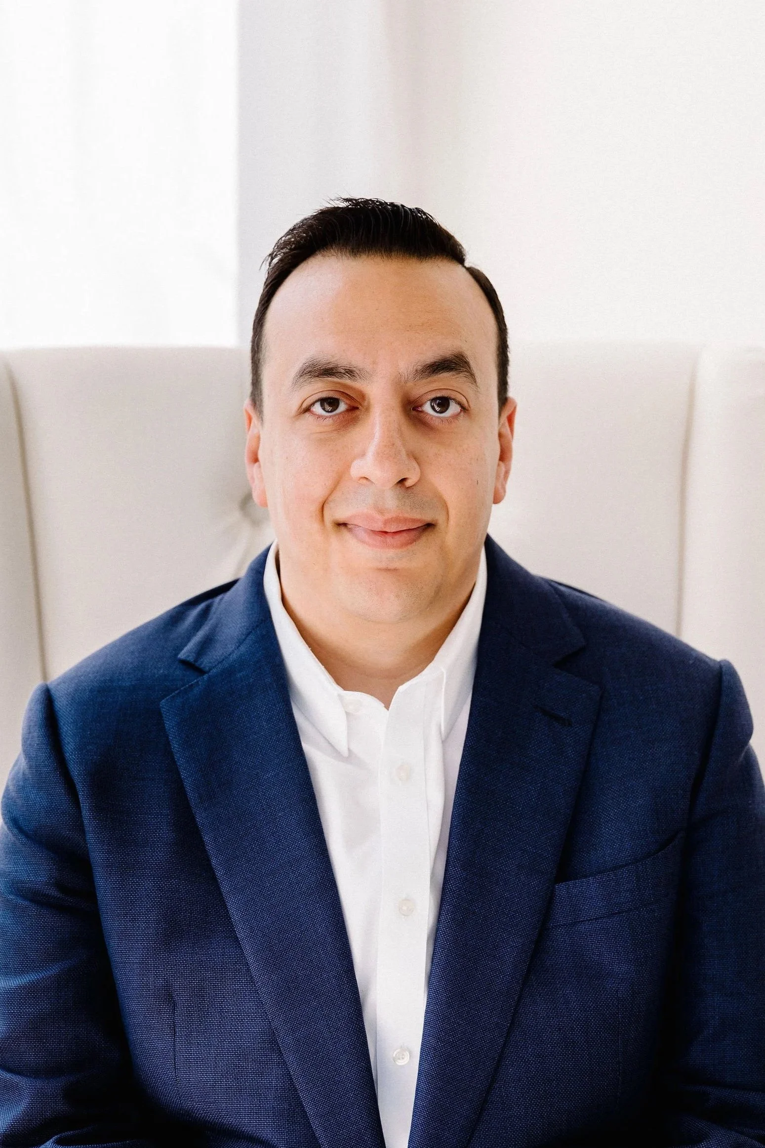 Image of Andrew sitting in a chair.