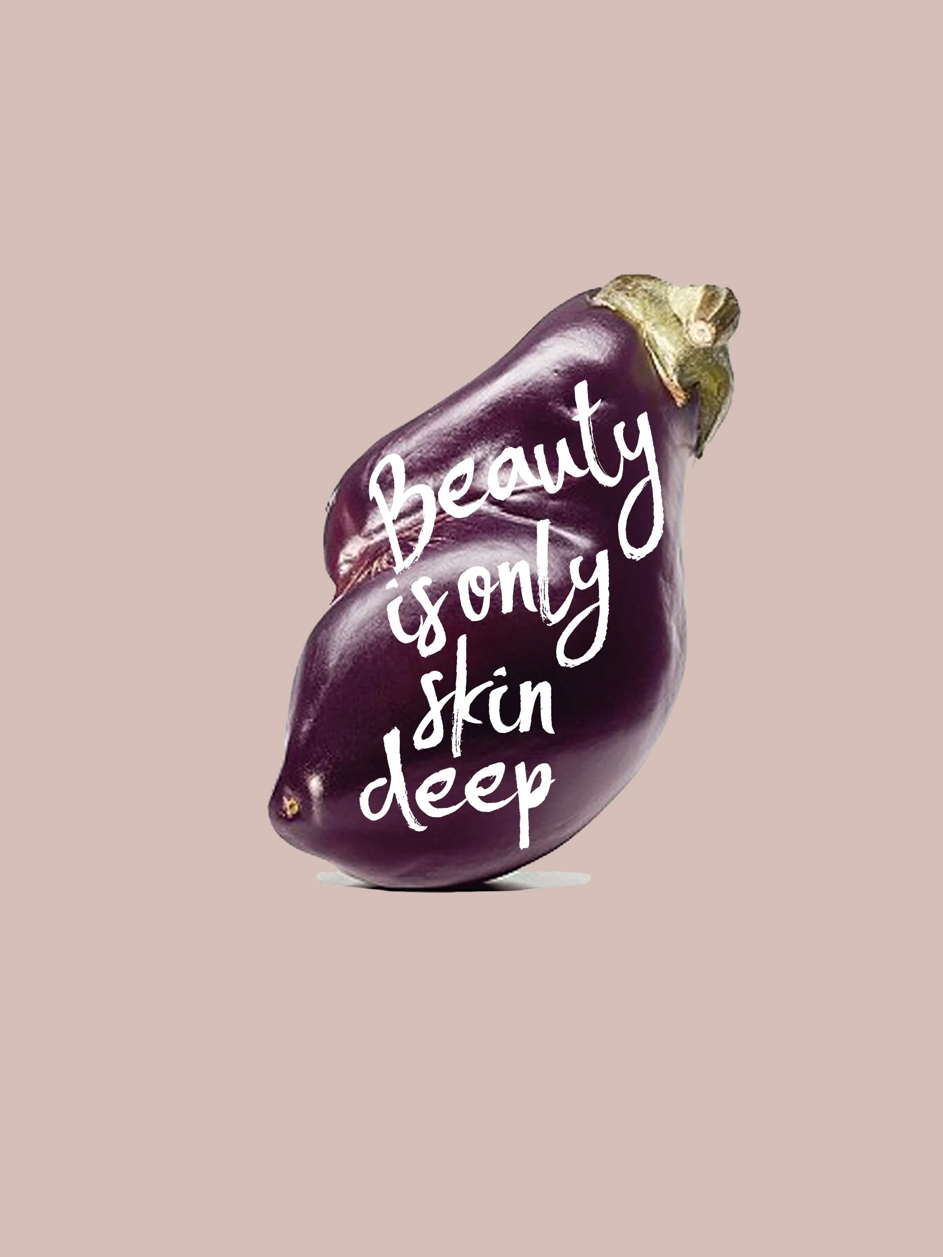 A deep purple eggplant with the words 'Beauty is only skin deep' written in white script overlayed on it, set against a light beige background.