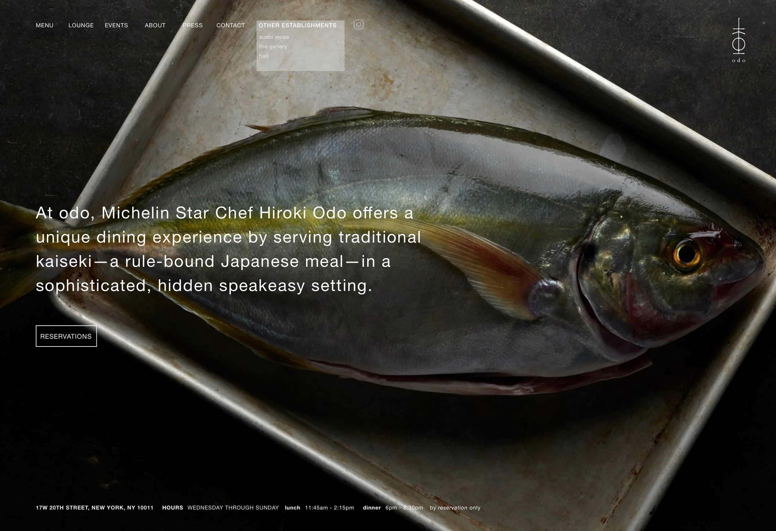 Close-up of a fish on a metal tray with text overlay about dining experience at Odo restaurant, a sushi and Japanese cuisine establishment in New York City.