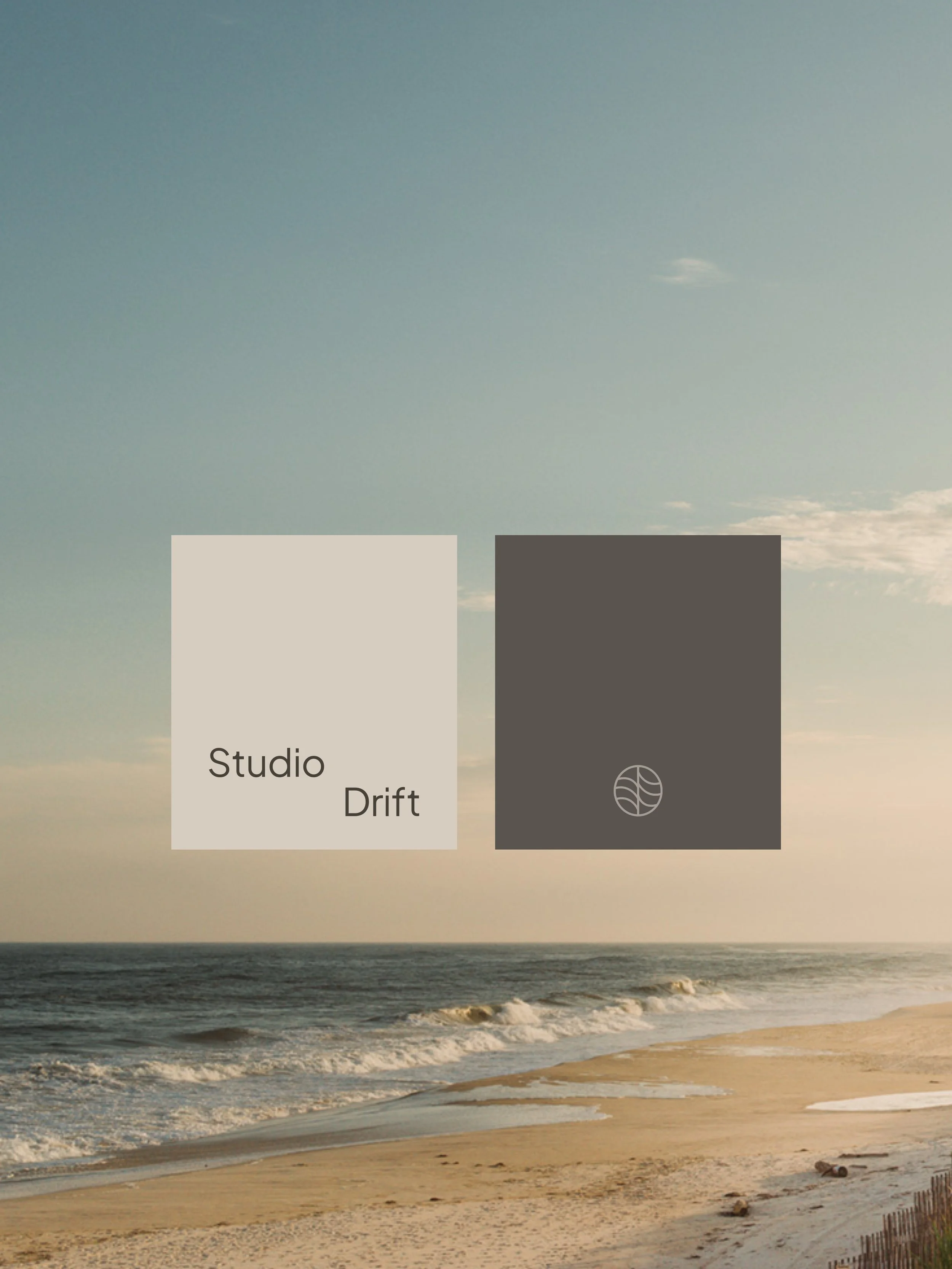 Beach with sand, ocean waves, and a cloudy sky at sunset. There are two color swatches overlaid on the image, one light beige labeled 'Studio' and one dark gray labeled 'Drift' with a circular leaf symbol.