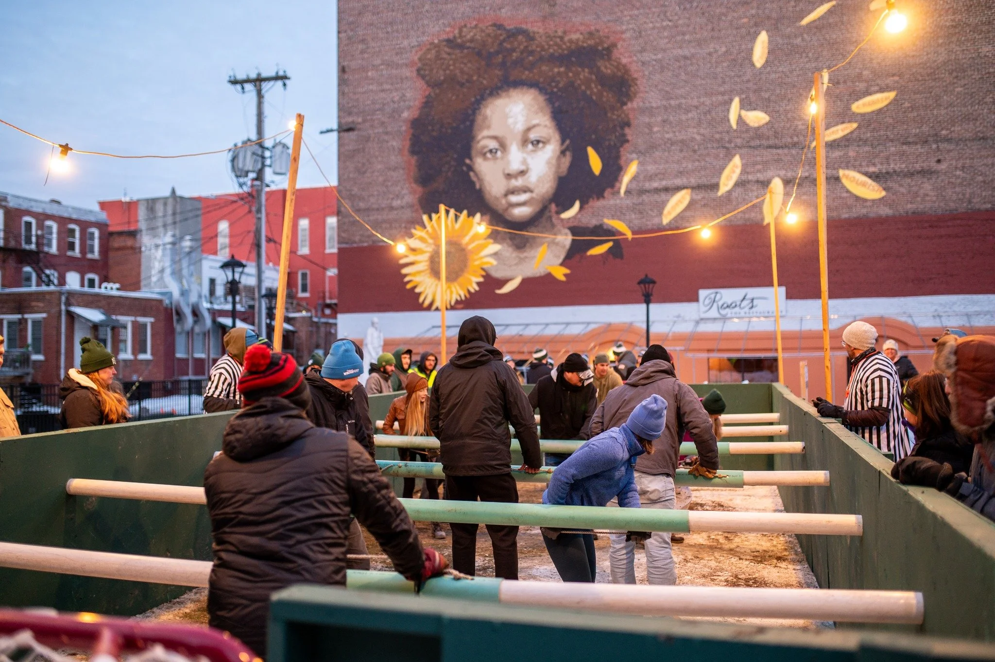 People set up in a human-sized foosball court in the Center Street Marketplace Park in Downtown Rutland, Vermont.