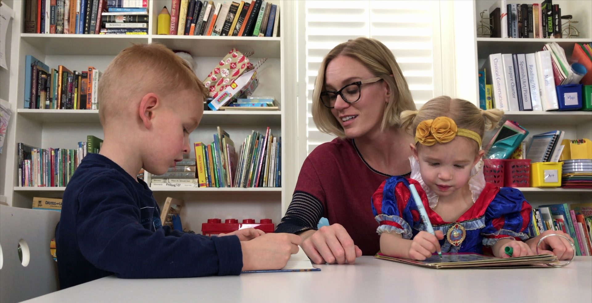Casey, Laila, Evan at Table.png