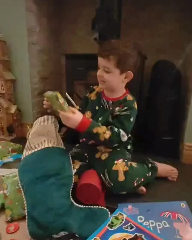 This was our Christmas.
Small hands tearing paper.
Wide eyes.
Pure, uncomplicated joy.

These moments happened alongside something much heavier, and that&rsquo;s the part I want to name. Because motherhood so often asks us to hold both.

To show up f