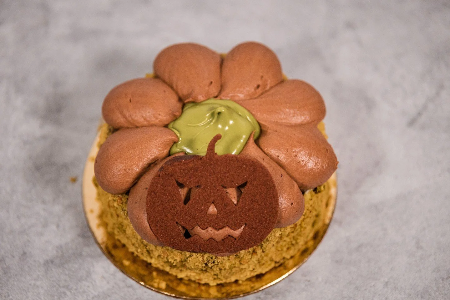 Sweet, spooky, and made with care. Our festive pastries are dressed for the occasion &mdash; featuring the Raspberry Pistachio Macaron, topped with an adorable chocolate pumpkin head. A little magic for your Halloween weekend.