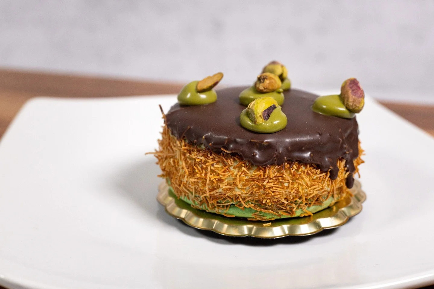 The Pistachio Raspberry Macaron just got an upgrade. You can call it the Pistachio Crunch, rolled in crispy kanafe and dipped in rich chocolate. A whole new layer of texture and flavor that takes this dessert to the next level.⁠