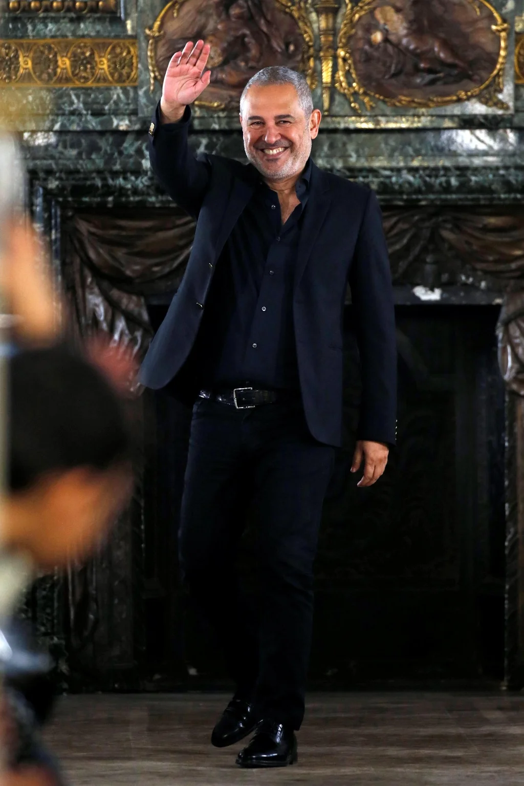 Designer Elie Saab takes a bow after his autumn/winter 2019 show during Paris Fashion Week. Reuters