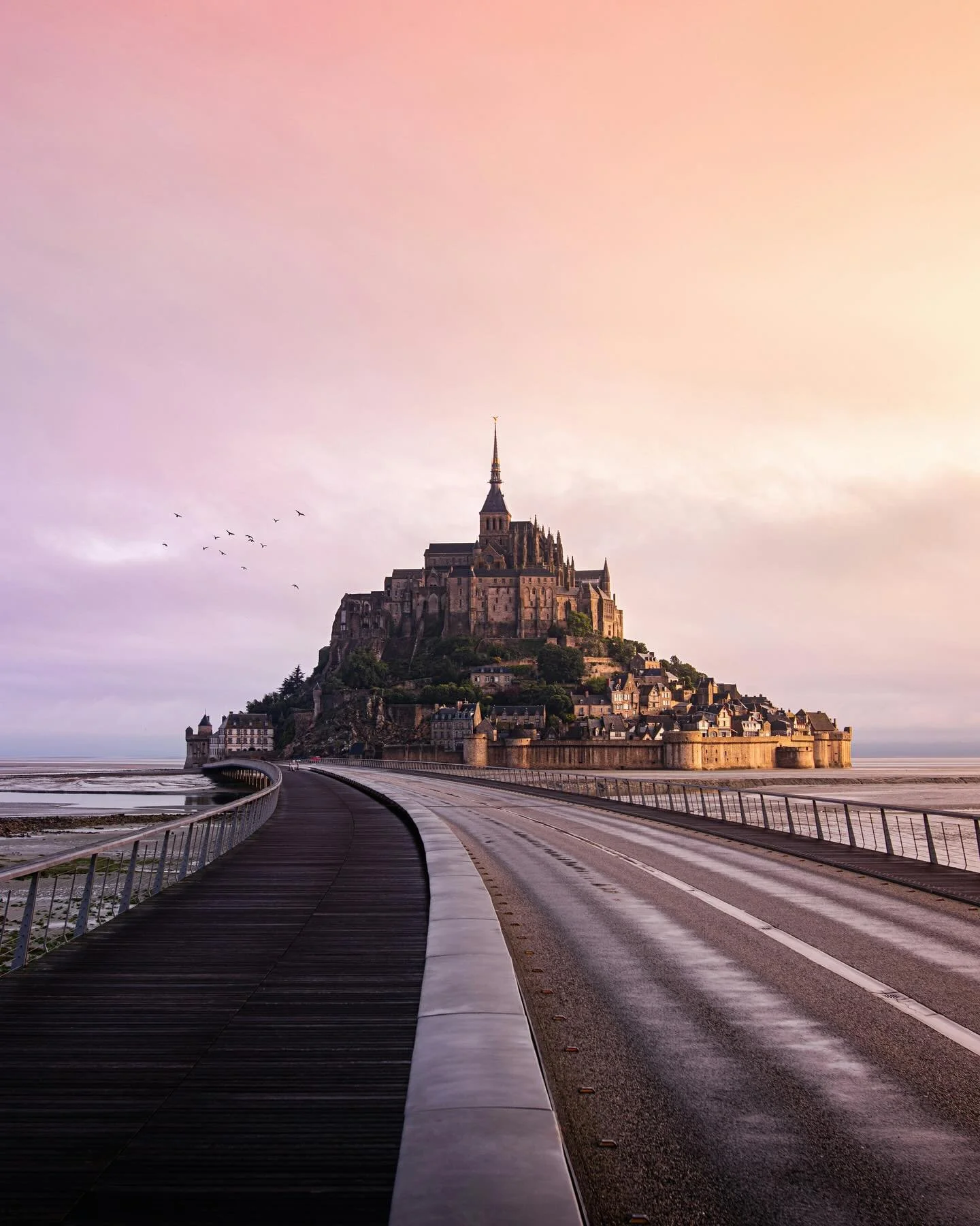 There&rsquo;s something magical about Mont-Saint-Michel in autumn. The air is cool, the crowds are gone, and the colors seem softer, golden stone against a pink sky. Walking along the causeway as the tide pulls away, you can hear nothing but the wind