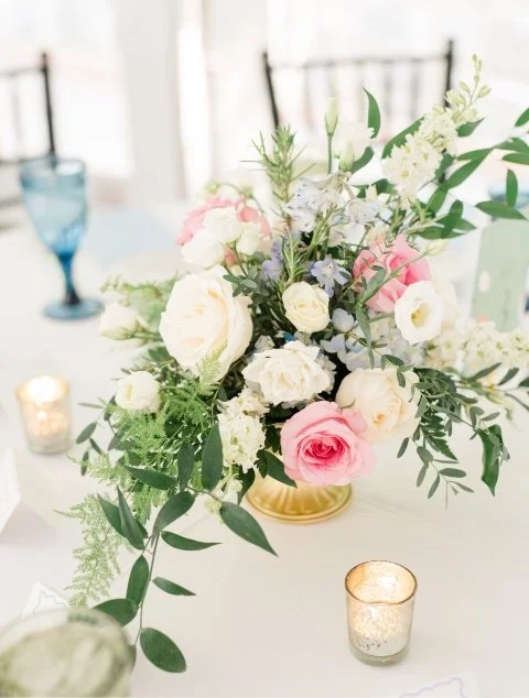 Gorgeous floral centerpiece with votive candles
