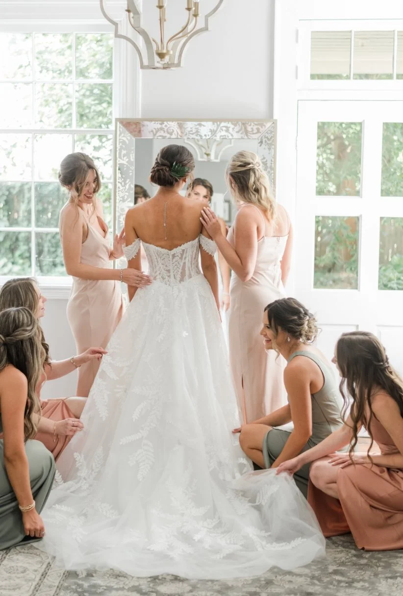 Bride prepping in the full length mirror