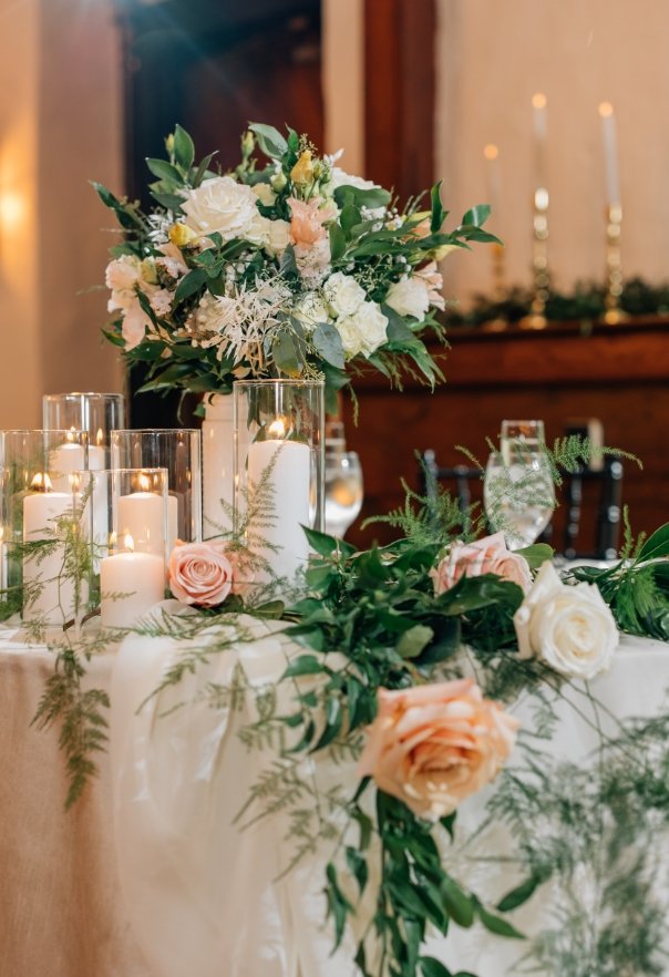 Beautiful florals on table with candles