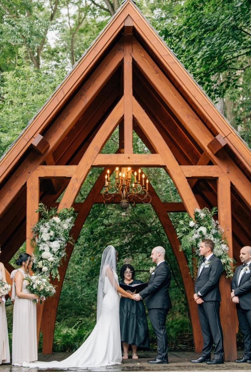 Saying vows under the wooden Abbey arch