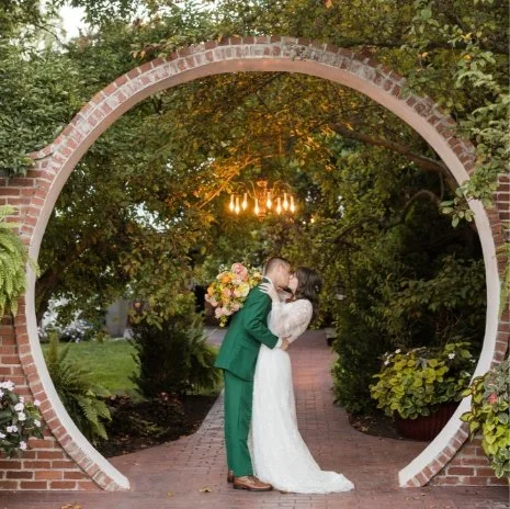 Couple kissing under the moongate