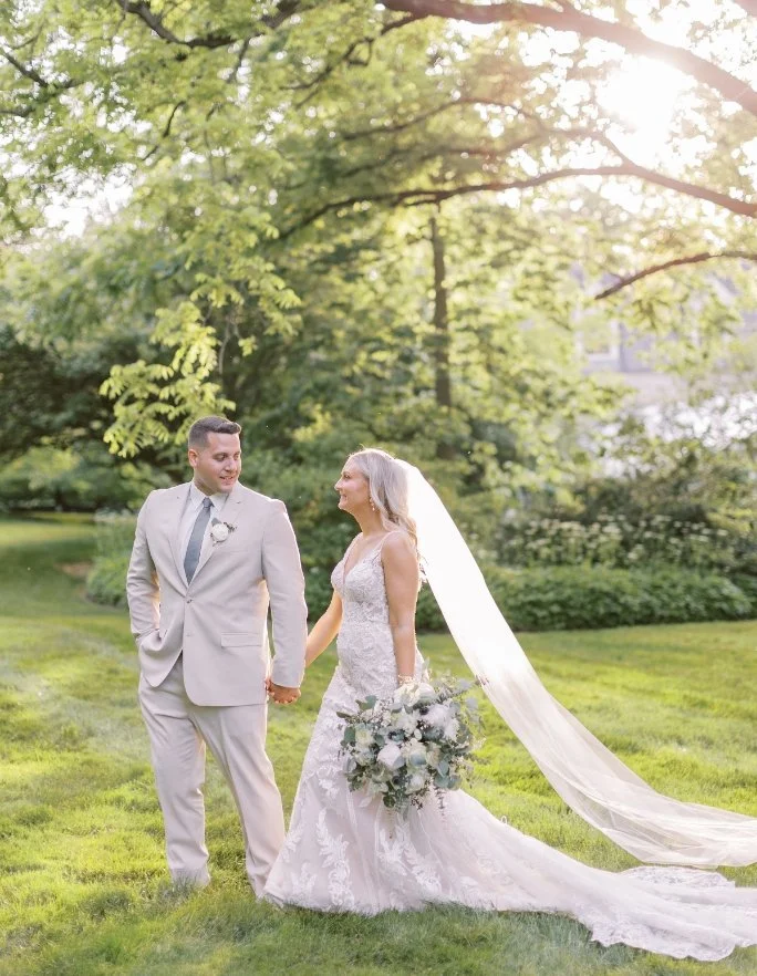 Couple walking in the field with beautiful, airy light