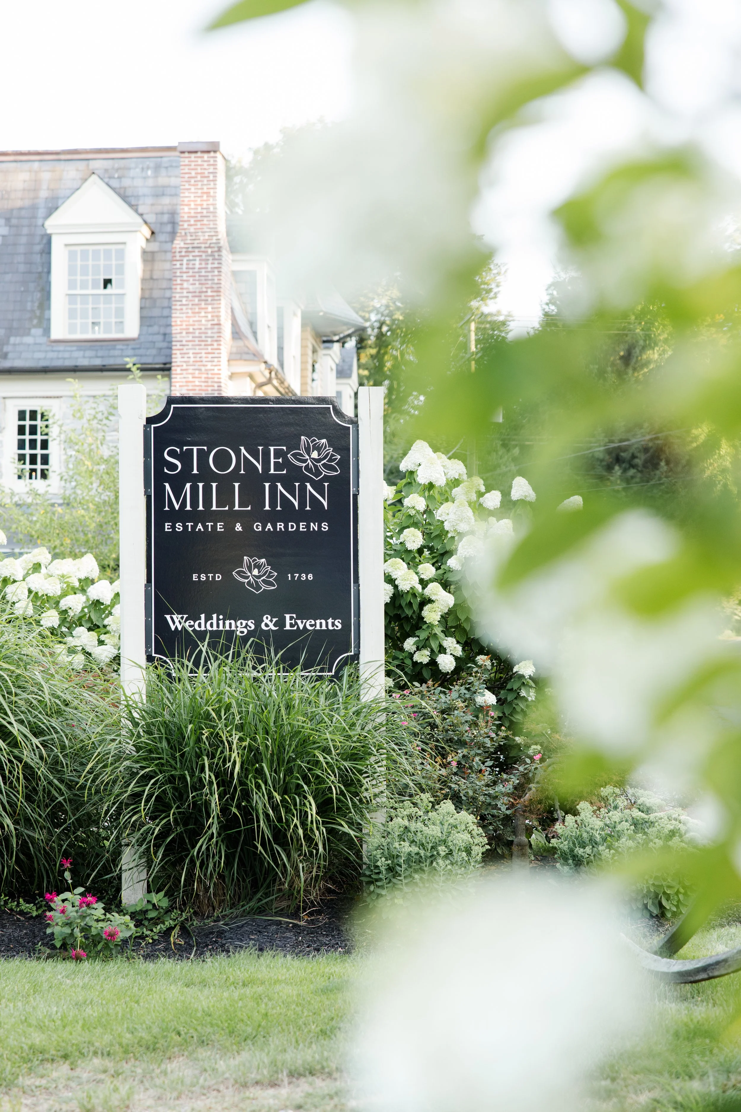 stone mill inn entrance sign
