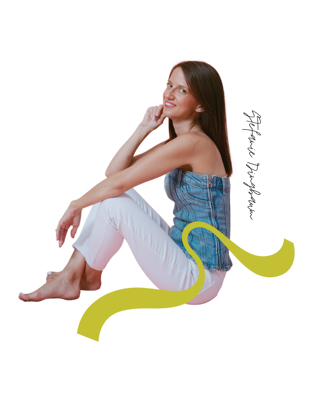 A woman sitting on the floor with her knees up, wearing a denim top and white pants, smiling and looking at the camera with a hand resting on her cheek. A yellow snake illustration is next to her.