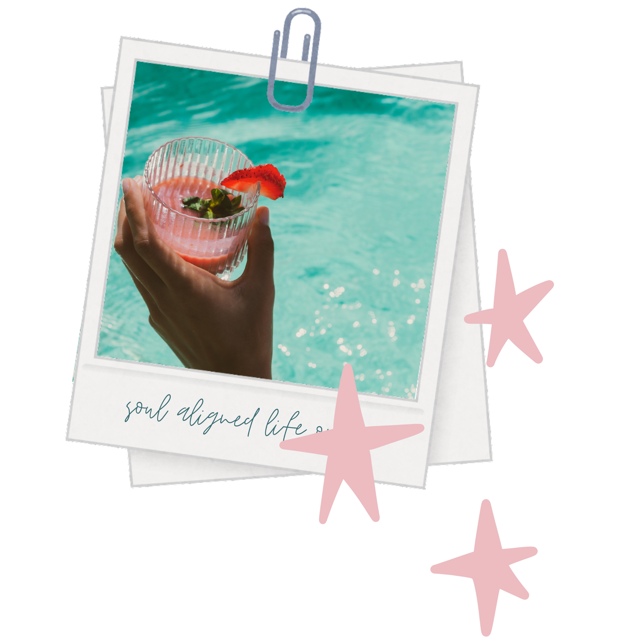Polaroid-style photo of a hand holding a glass of pink beverage with a strawberry garnish, with a swimming pool in the background, decorated with pink star-shaped stickers and the handwritten phrase "soul aligned life".